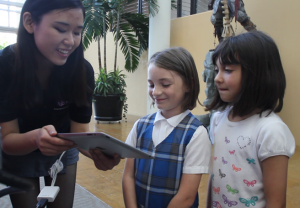 Cheng showing TuneTrain to Girl Scouts