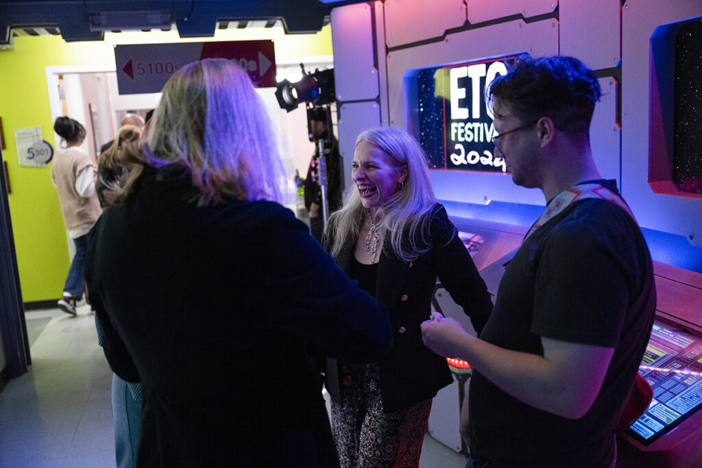 ETC Director of Marketing and Admissions Rebecca Lombardi talks with Festival guests