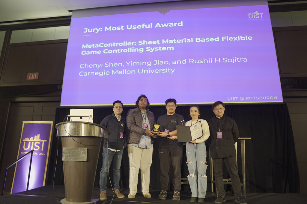 Sojitra and team accepting the award for his poster at UIST