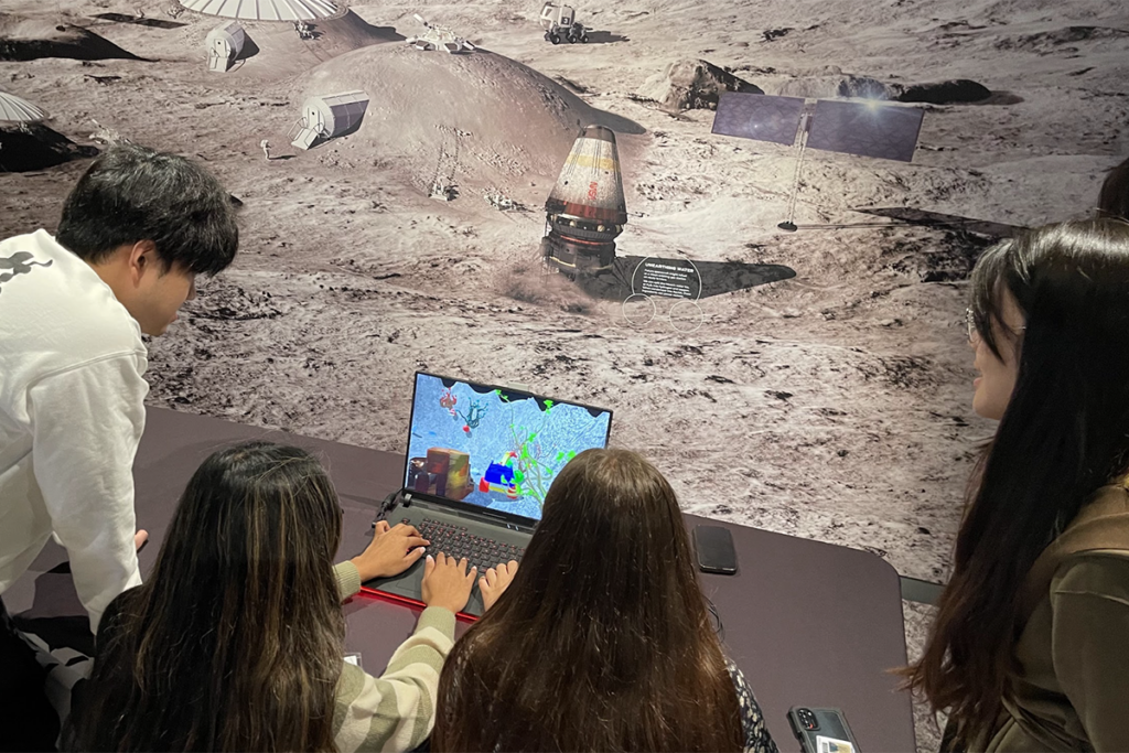 The Moonrover team playtesting the game at the Moonshot Museum