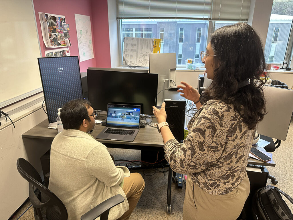 Second-year student Kesha Bagadia explains the premise of Spring 2025’s Mic Check’s project, a game where players compete in a rap battle against AI opponents.