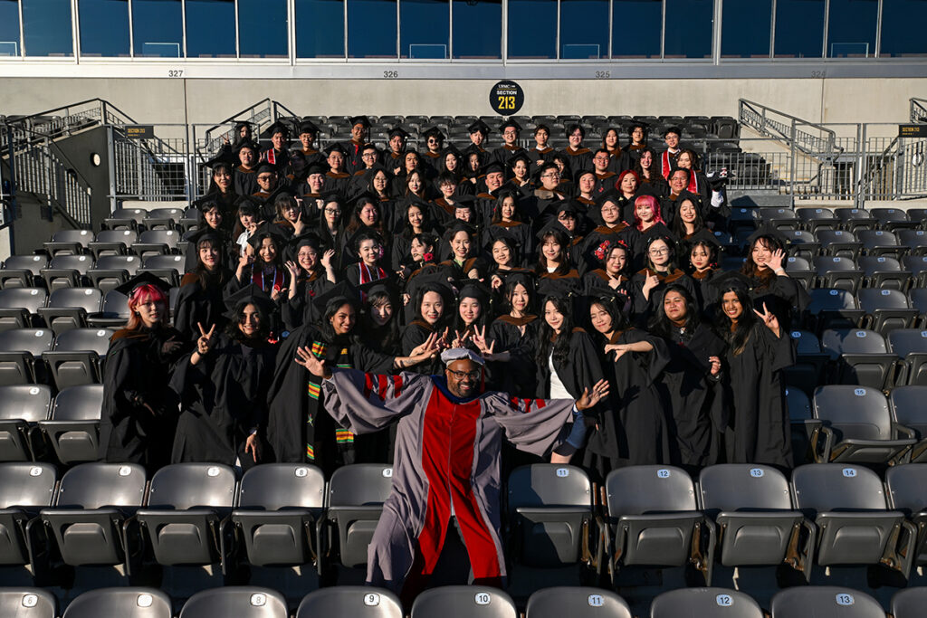 ETC Director Derek Ham poses with the graduating ETC class