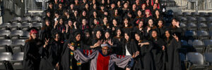 ETC Director Derek Ham poses with the graduating ETC class